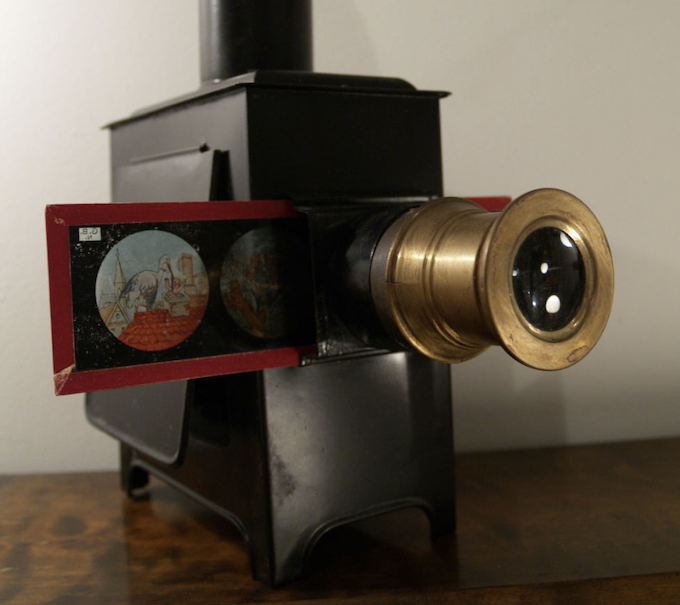 Screenshot 2026-10-06 at 113648 AM - The Gleaner Vintage View-Master stereo viewer on a black stand with a red slide cartridge showing two circular images.